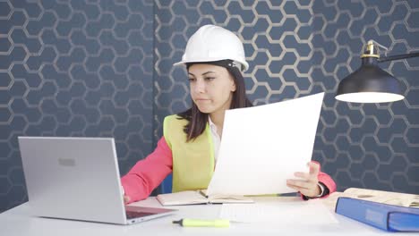 Woman-engineer-working-on-project-on-laptop.